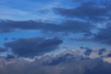 Fototapeta na wymiar gray black clouds in the blue evening sky