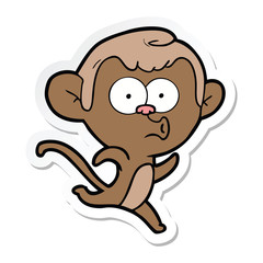 sticker of a cartoon surprised monkey