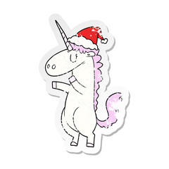 distressed sticker cartoon of a unicorn wearing santa hat