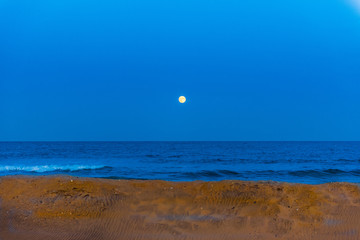 Moon over Deep Blue Ocean