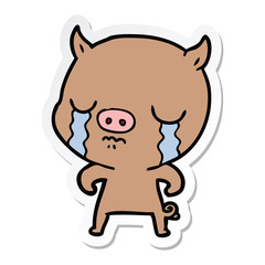 sticker of a cartoon pig crying