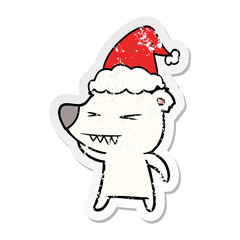 angry polar bear distressed sticker cartoon of a wearing santa hat