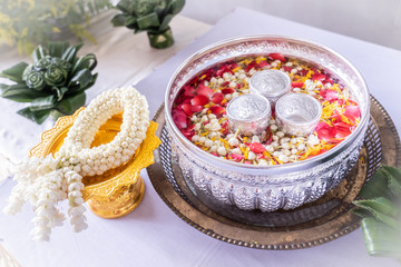 Jasmine and roses in blow water for blessing ceremony of adults, Songkran festival in Thailand.