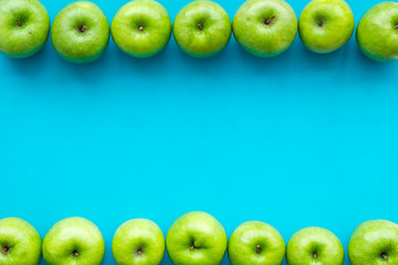 green apples for organic summer food pattern on blue background top view mockup