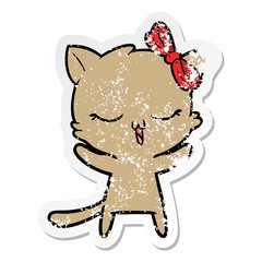 distressed sticker of a cartoon cat with bow on head