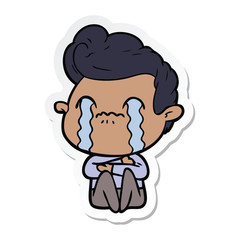 sticker of a cartoon man crying