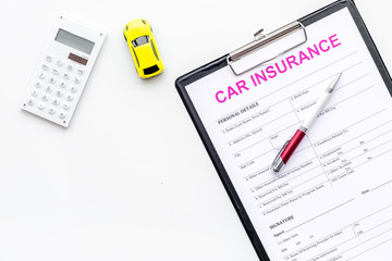 Car insurance concept with form, car toy and calculator on white background top view space for text