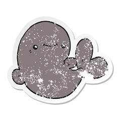 distressed sticker of a cartoon whale