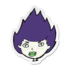 sticker of a cartoon vampire head