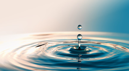 Clear Water drop with circular waves - Powered by Adobe