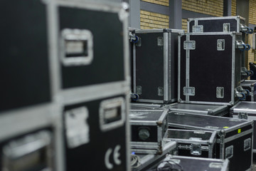 Stage equipment behind the scenes. Concert activity. Cases for transportation of equipment. Boxes...