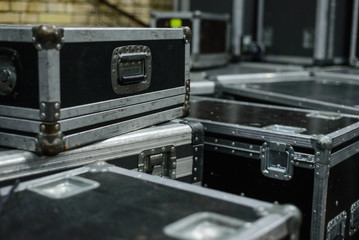 Stage equipment behind the scenes. Concert activity. Cases for transportation of equipment. Boxes...