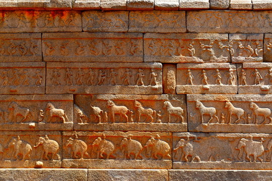 Old stone wall with sculpture work 