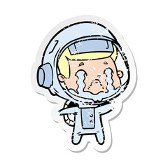 distressed sticker of a cartoon crying astronaut