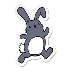sticker of a cartoon rabbit running
