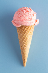 Scoop of Strawberry Ice Cream in a Waffle Cone