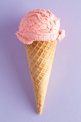 Scoop of Strawberry Ice Cream in a Waffle Cone