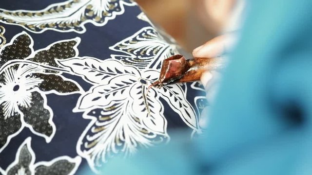 Close up, creating Batik traditionally hand made in Yogyakarta city.