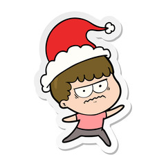 sticker cartoon of a annoyed man wearing santa hat