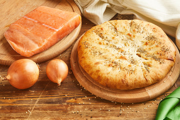 Pie with salmon fish and onion