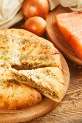 Pie with salmon fish and onion
