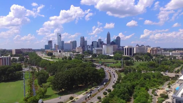 Aerial drone shot of Charlotte, NC city skyline. This clip was filmed midday during the summer.