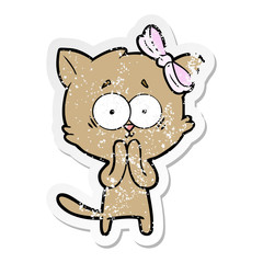distressed sticker of a cartoon cat