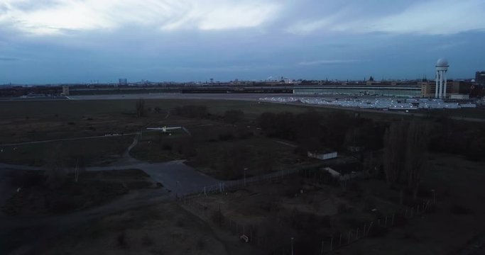Aerial turn of the decommissioned Tempelhof Airport just before nightfall