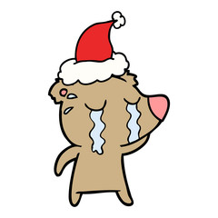 line drawing of a crying bear wearing santa hat