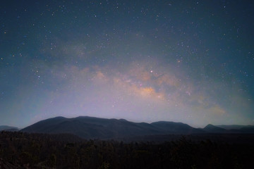 milky way, stary night landscape over mountain,