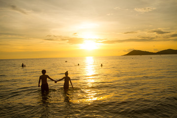 people walk in Sea Sunset,
