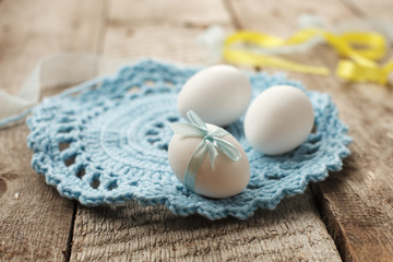 Easter holiday card with variety of easter eggs on vintage wooden rustic background with copy space