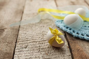 Easter holiday card with variety of easter eggs on vintage wooden rustic background with copy space