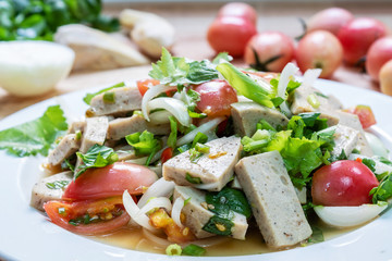 fresh salad with tomatoes and Vietnamese sausage