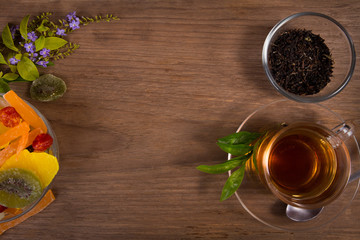 tea and dried fruits on wooden table