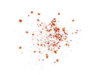 pile crushed red cayenne pepper, dried chili flakes and seeds on white background.