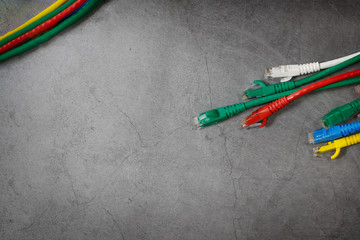 Close up multicoloured ethernet network cables  on gray background,Bunch of multicolored RJ45...