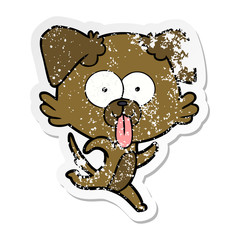 distressed sticker of a cartoon dog with tongue sticking out