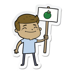 sticker of a happy cartoon man with apple placard