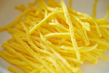 Thin sliced fried egg