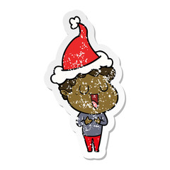 laughing distressed sticker cartoon of a man wearing santa hat