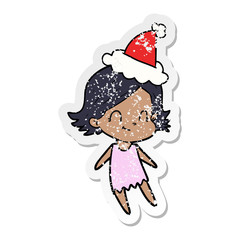 distressed sticker cartoon of a friendly girl wearing santa hat