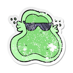 distressed sticker of a cool cartoon amoeba