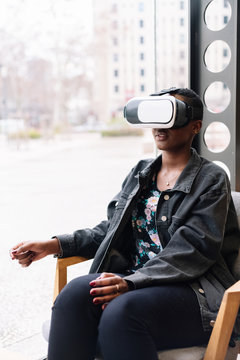 Young woman experimenting with virtual reality
