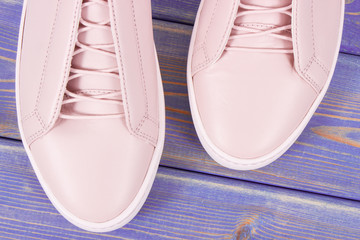 Womanly leather shoes on old boards