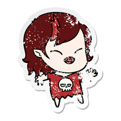 distressed sticker of a cartoon laughing vampire girl