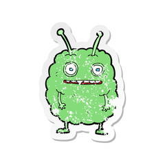 retro distressed sticker of a cartoon funny alien monster