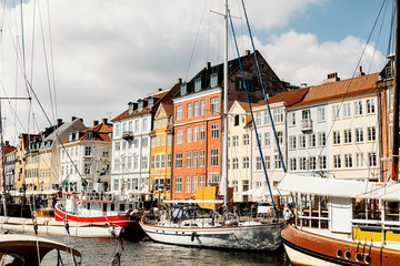 Row of traditional, colorful Danish buildings along the canal in Nyhavn.  Copenhagen, Denmark