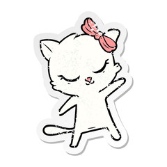 distressed sticker of a cute cartoon cat with bow