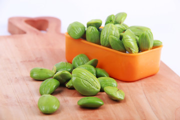 Parkia speciosa seeds or bitter bean on white background